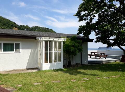 1 minute by car from South Barn German Village, a private house with a view of the sea