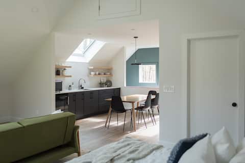 Modern studio with views of the treetops