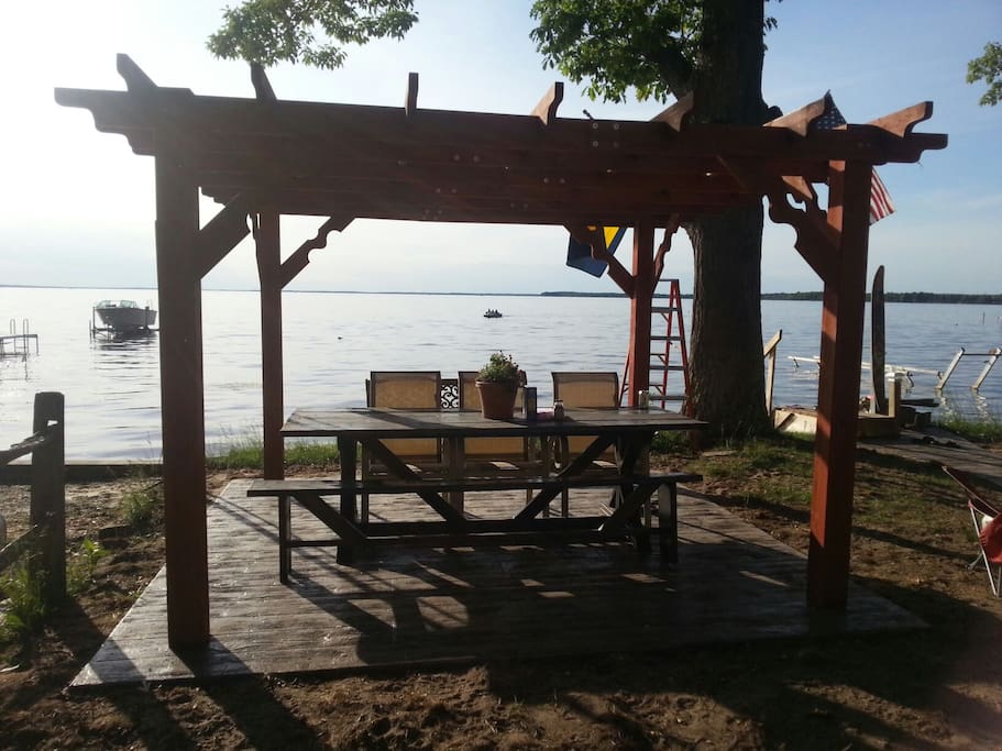 Stamped concrete patio with Pergola. Picnic table seats 12 adults.