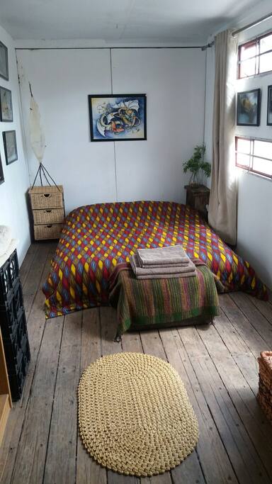 Converted container room looking over the river