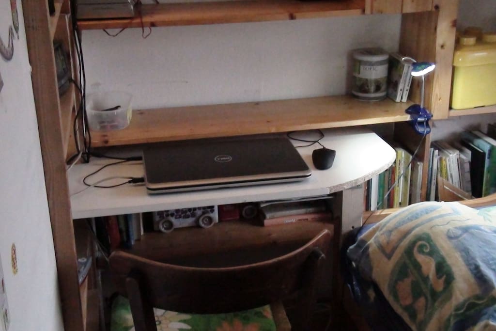 A small desk next to your bed