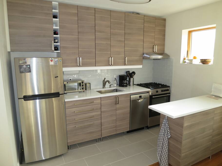 Brand new kitchen area with granite counters, dishwasher and 4-burner gas stove with oven. Renovated in 2017.
