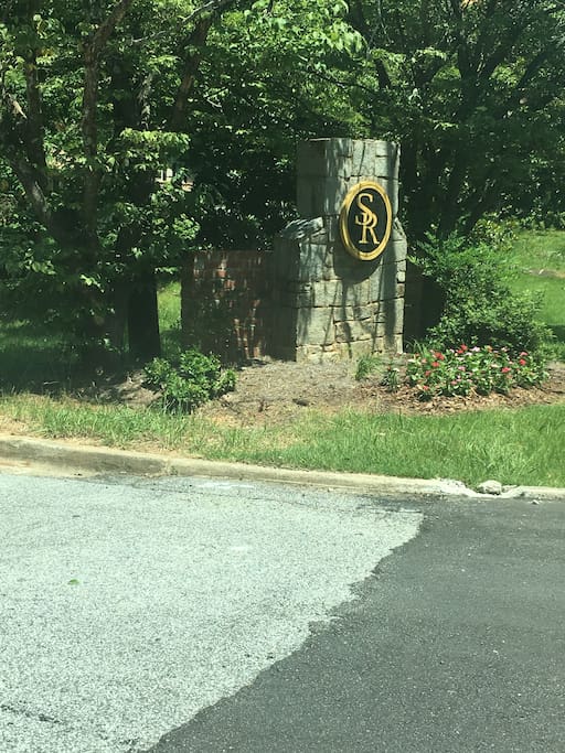 Smoke Rise sign on the front side of house