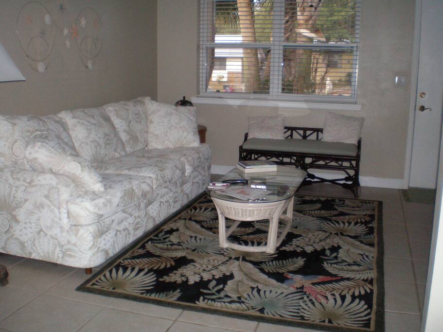 Living room with one of three TV's.