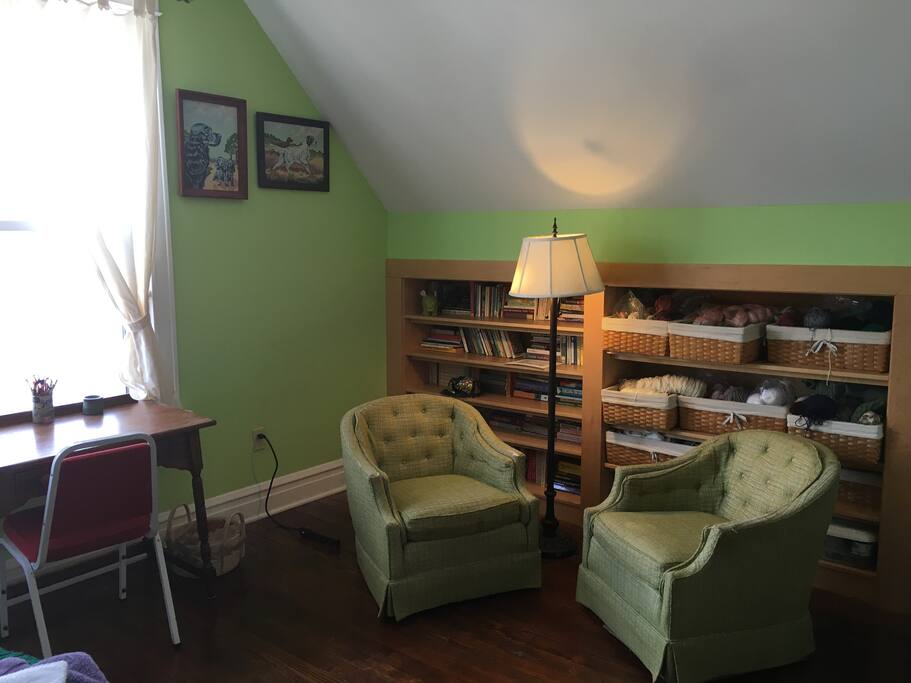 East bedroom sitting area and work desk.
