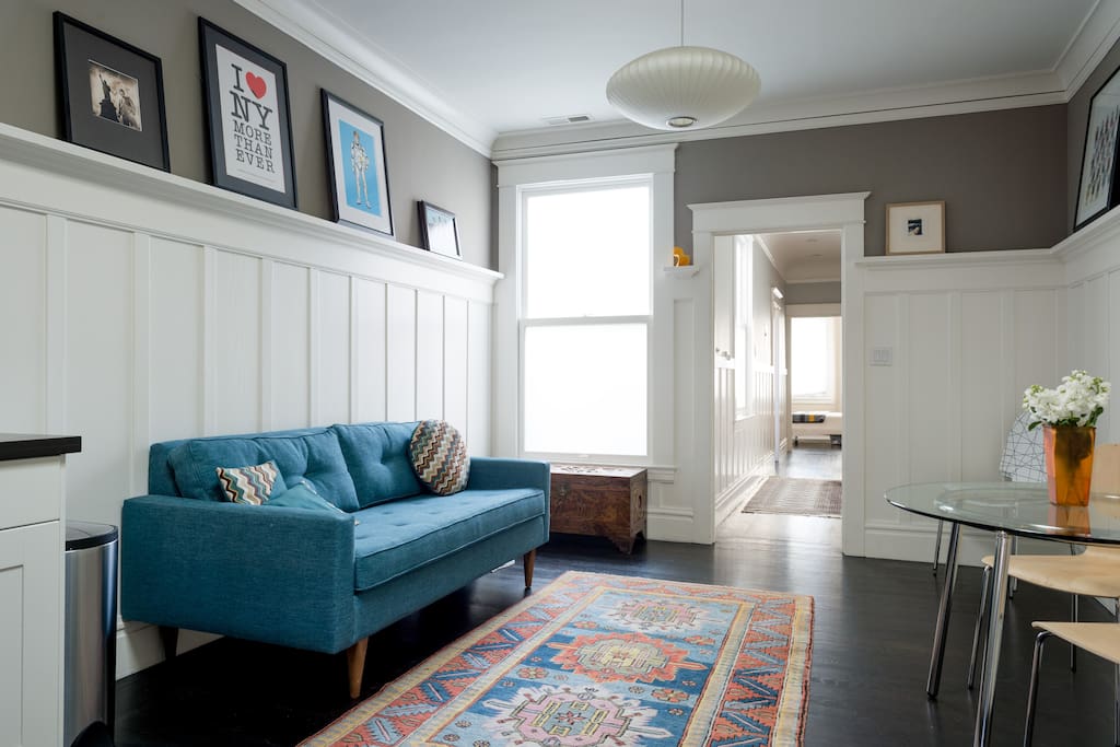 The living area of the flat is a combined space that is both sitting area and eat-in kitchen. We have plenty of glassware, dishes, pots, pans, and all the rest if you opt to eat in.