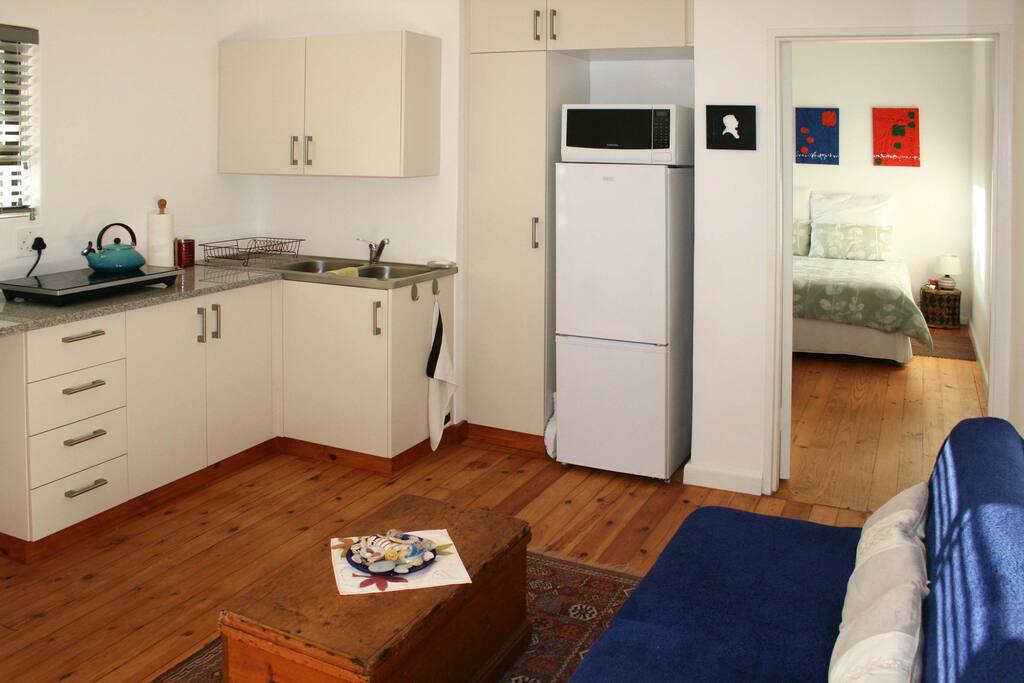 Living room with the kitchen area.