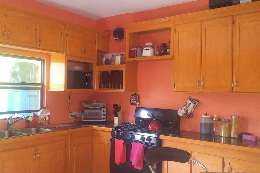Our modern bright kitchen comes with gas stove (instructions for use provided), toaster oven, microwave & blender