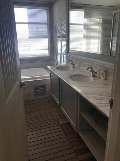 Master Bathroom with wooden flooring and marble top