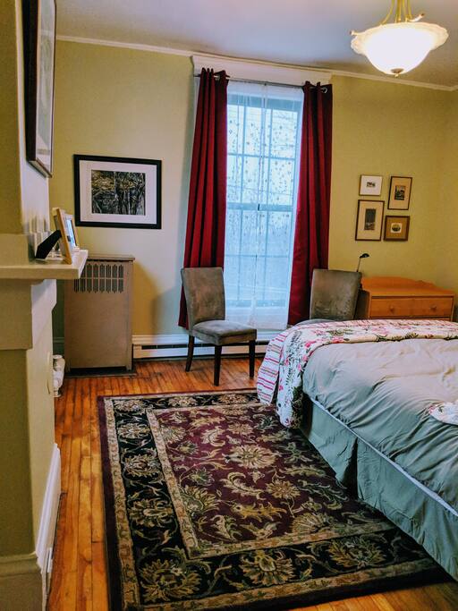 Looking from living room into bedroom, with light-blocking curtains.