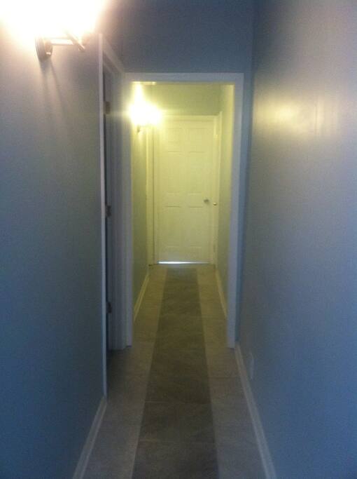 Interior hall to two bedrooms and livingroom at far end