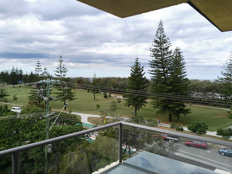 view from the unit across the street to the park beach