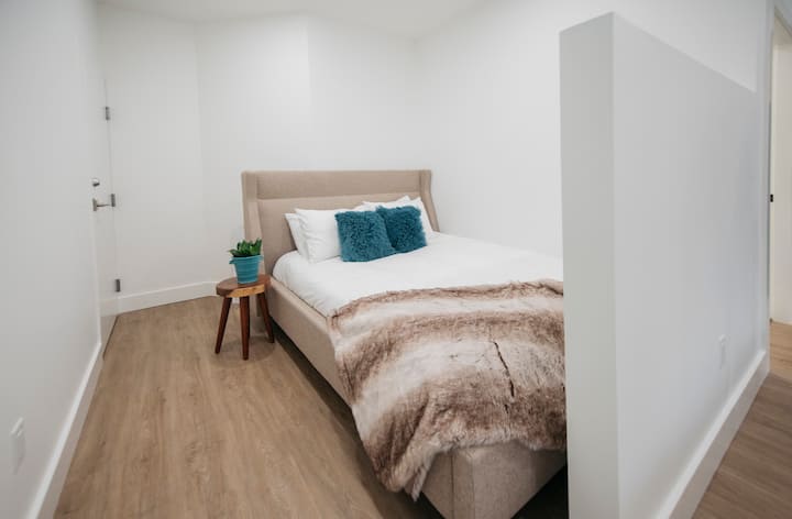 This comfortable queen bed has a medium to firm mattress from Canadian company:  Endy.  