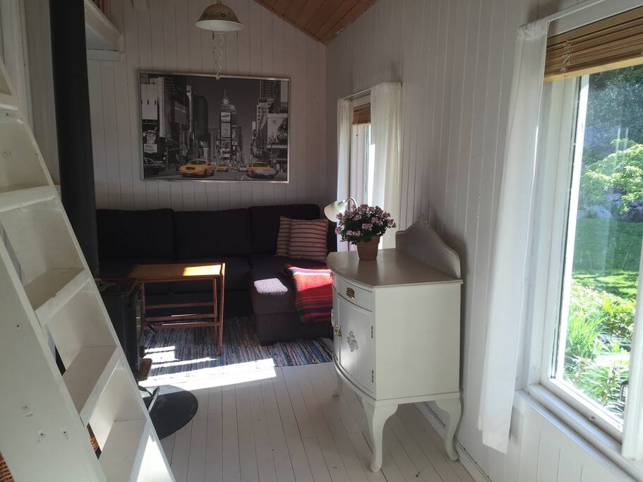 The sofa in the fare end is a sofa bed, big enough for two people. The loft, up the stairs, has room for a mattress og two and works out as a sleeping area for children (for free).