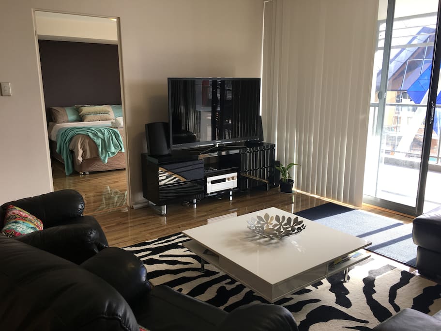 Large comfortable lounge with huge TV