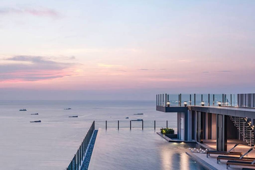 Rooftop swimming pool sunset view