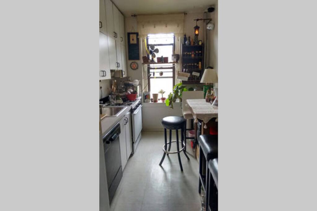 Eat-in kitchen with plenty of pots and pans. You can use them all.