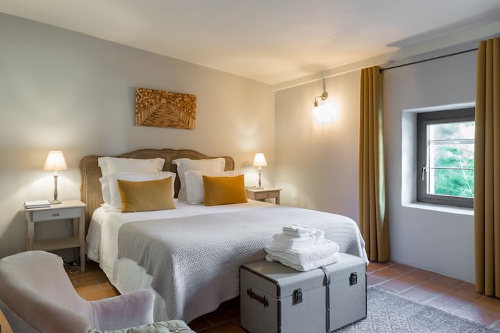 Bedroom 2 with Kingsize bed, a built-in closet, an ensuite bathroom and desk (north facing, cooler in the summer)