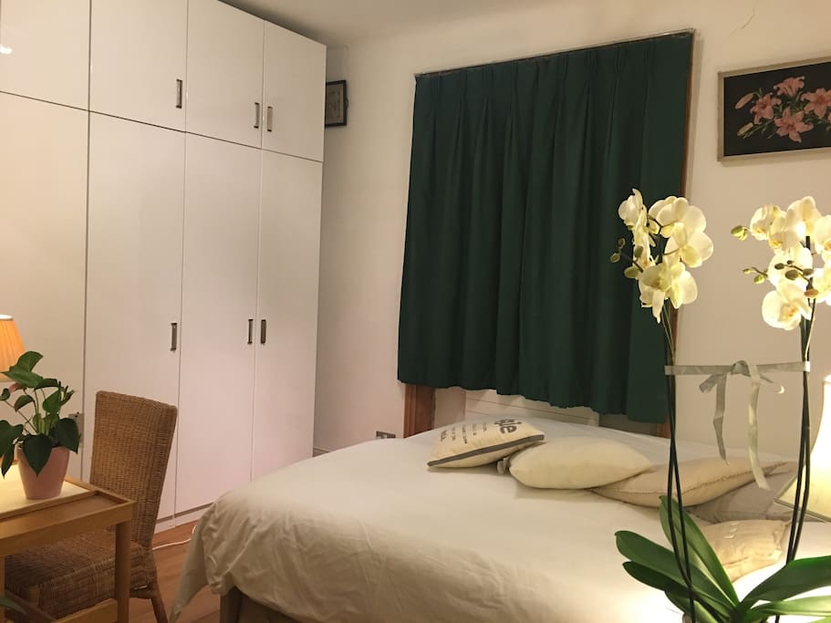 Master bedroom with super king size bed and tranquil room with a view