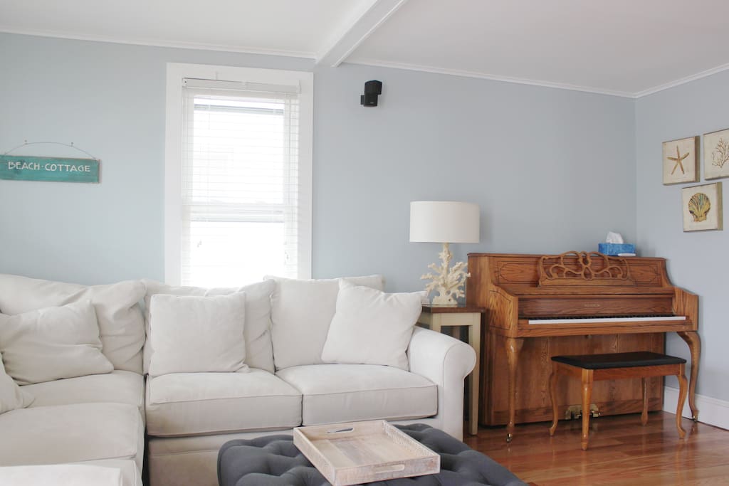 Upright piano in living for you to enjoy