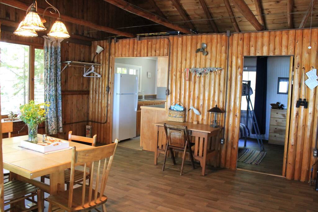 Dining area with desk along wall.