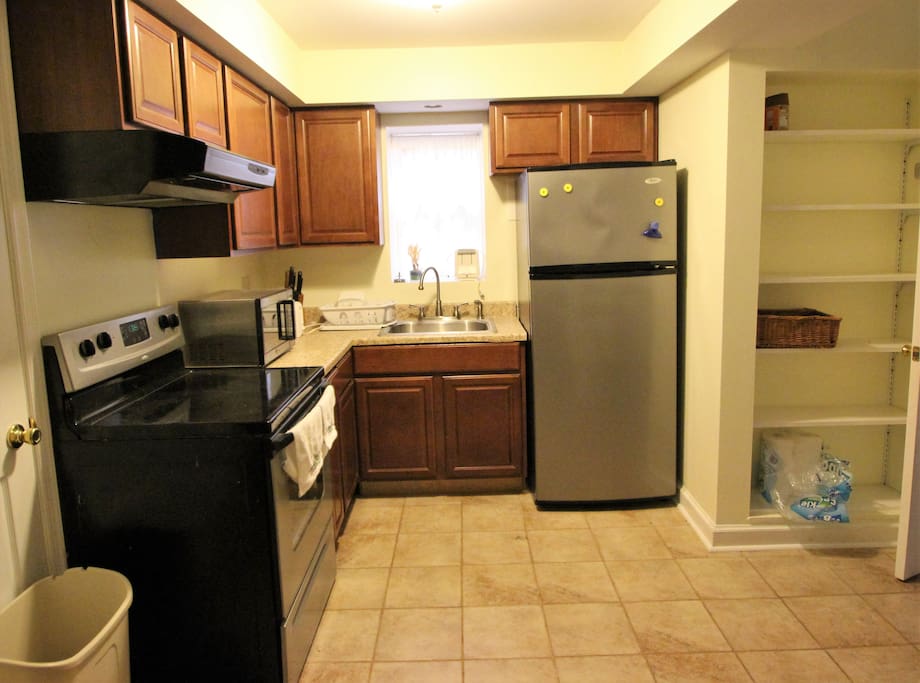 Full size stove and fridge; counter microwave.