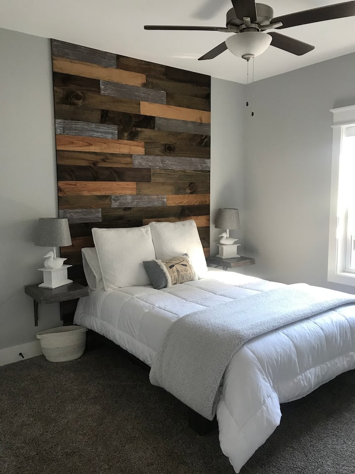Enjoy waking up in our second guest room with a floor to ceiling headboard crafted by the owners.  USB ports provided in each bedroom for your convenience.
