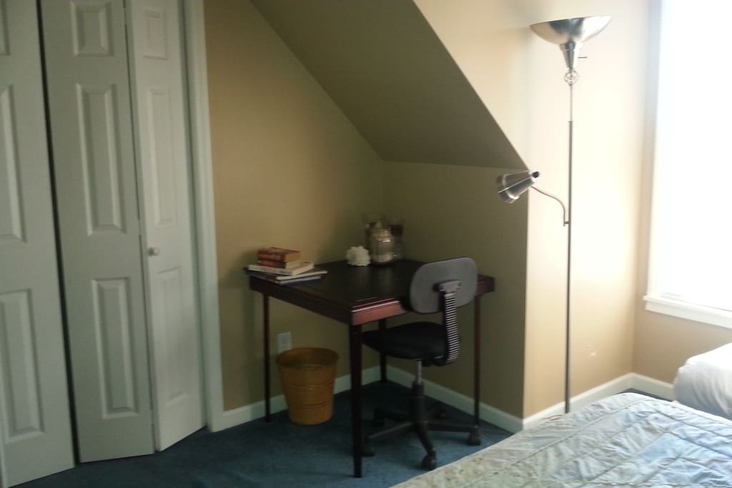 Bedroom 1, meditation space by window, table/chair for working, and large closet for your things