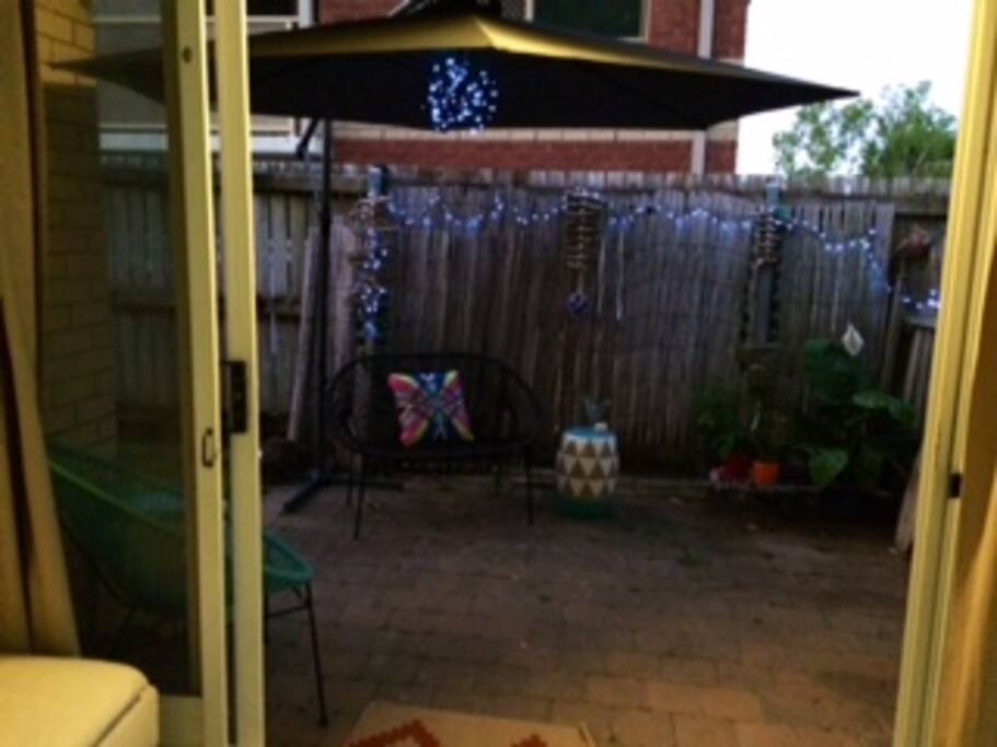 Outdoor area. Grassy backyard and full kitchen as well.