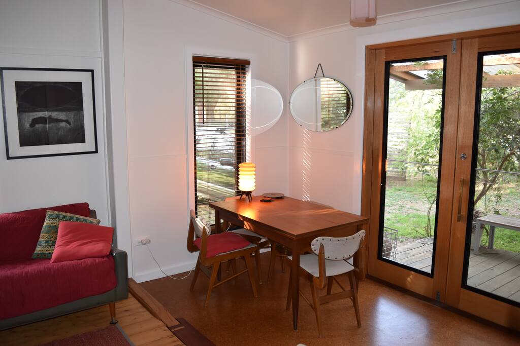 Extendable dining table gives you room to work and read in beautiful light or share meals in the indoor outdoor space.