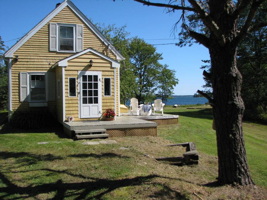 View of water from the deck and a large back yard.