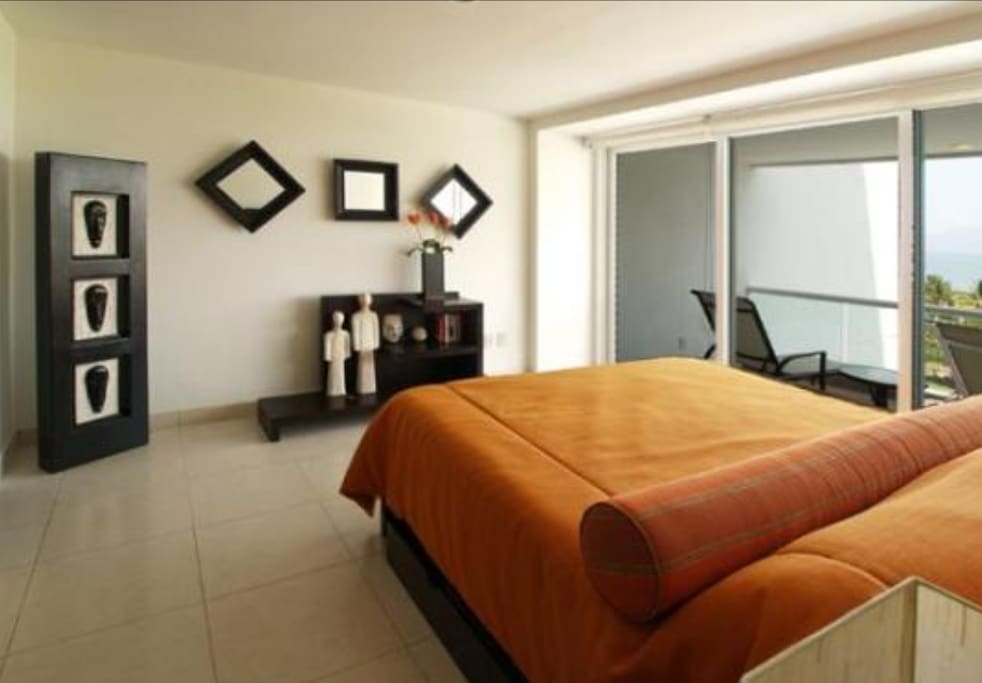 master bedroom with balcony , ocean and patio view!