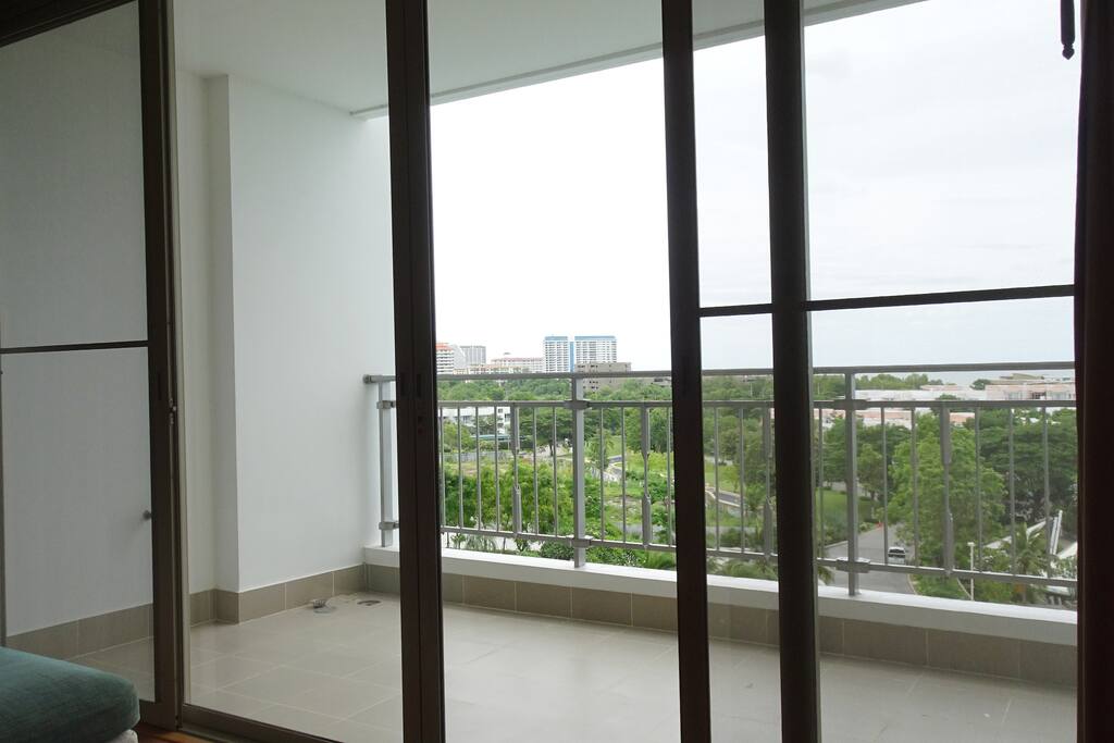 Spacious balcony with table and chairs