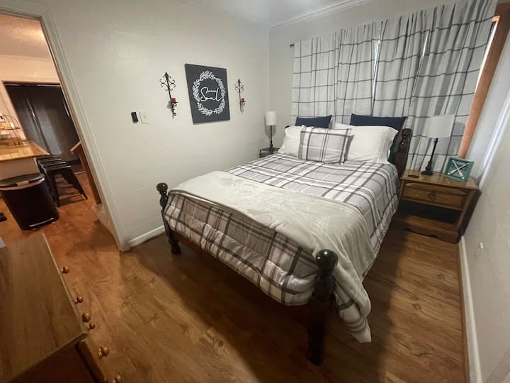 Downstairs bedroom with queen bed