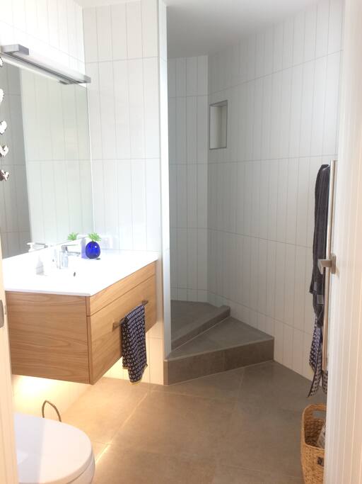 Walk in, large open tiled shower, heater & heated rails