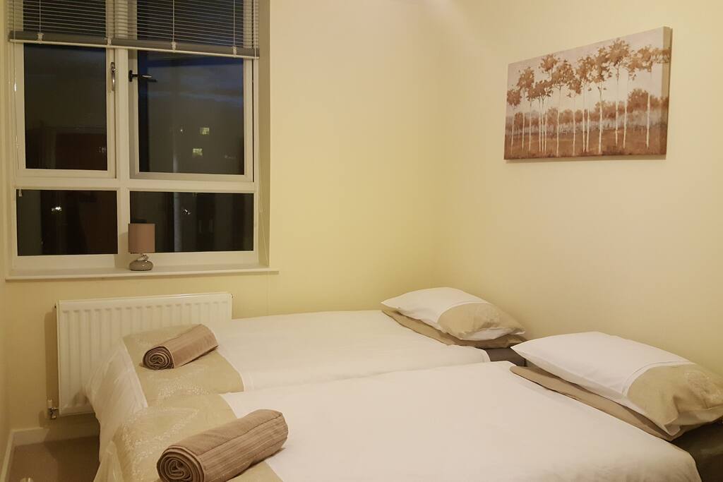 Bedroom 1 with two single beds