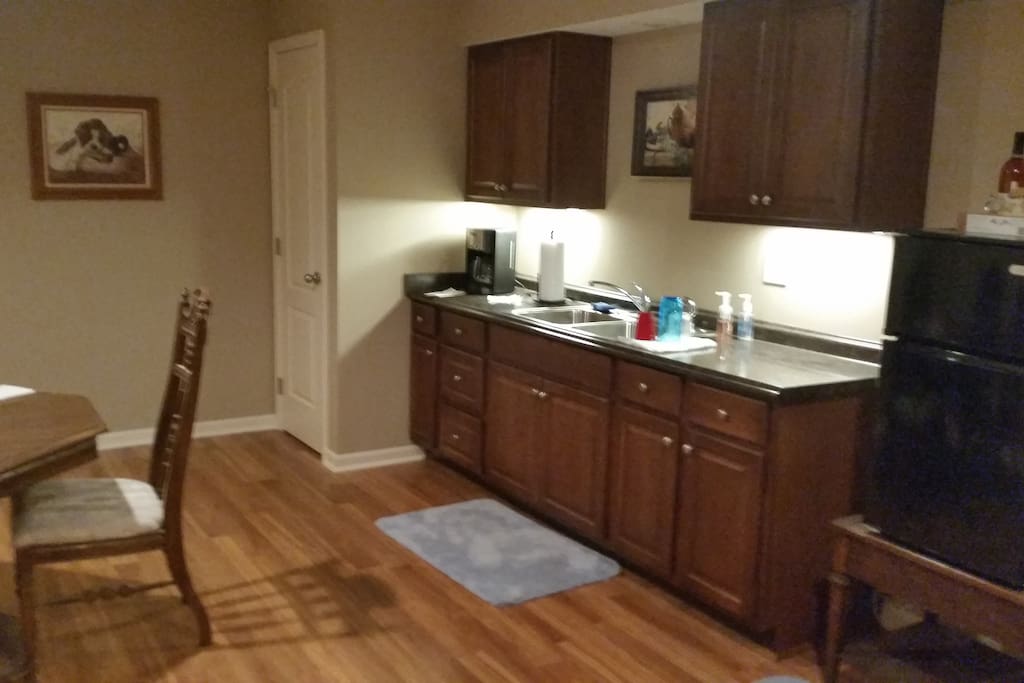 Spacious Full Kitchenette with Fridge and Dining area andTable.