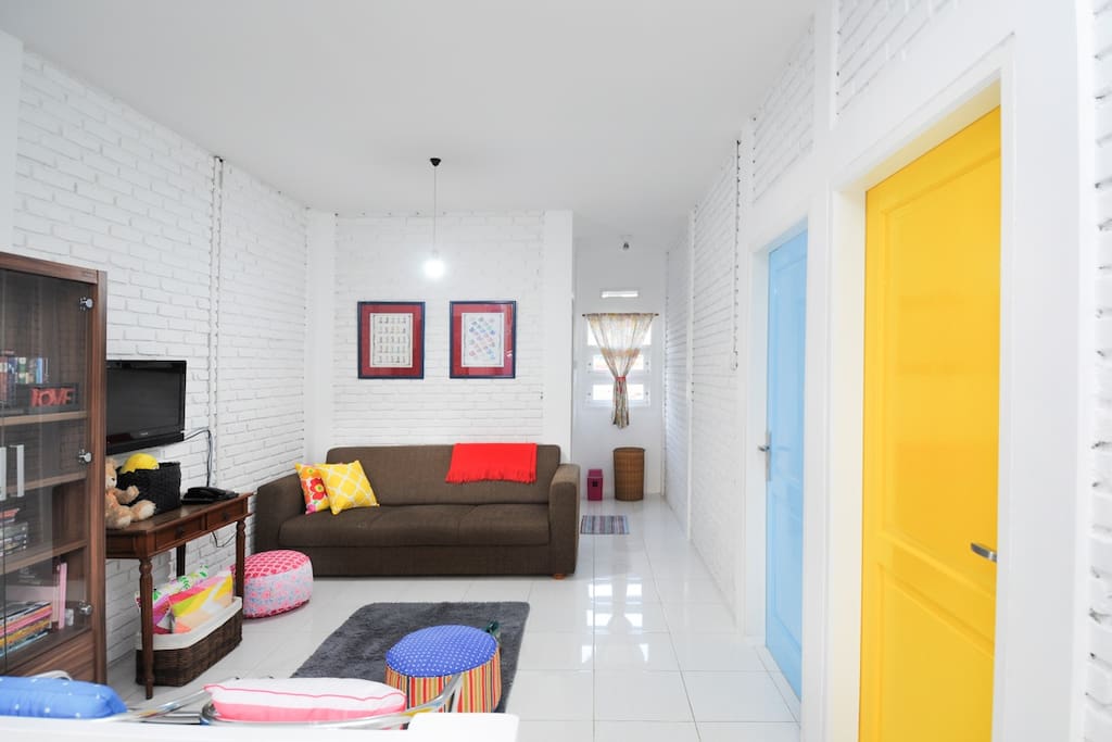 your rooms on the right with blue and yellow door
