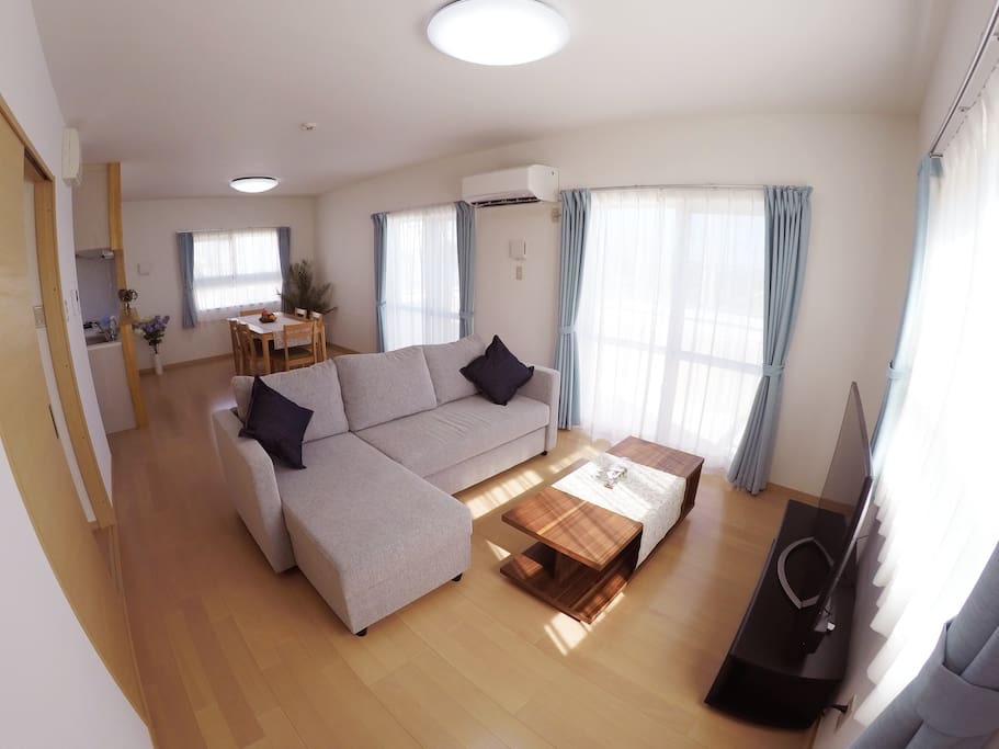 Large living room area is on the second floor, with a large sofa bed.