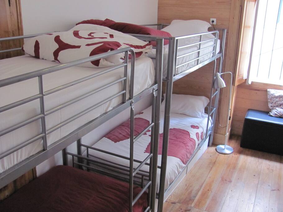 Bunk-beds with bed linen and duvet