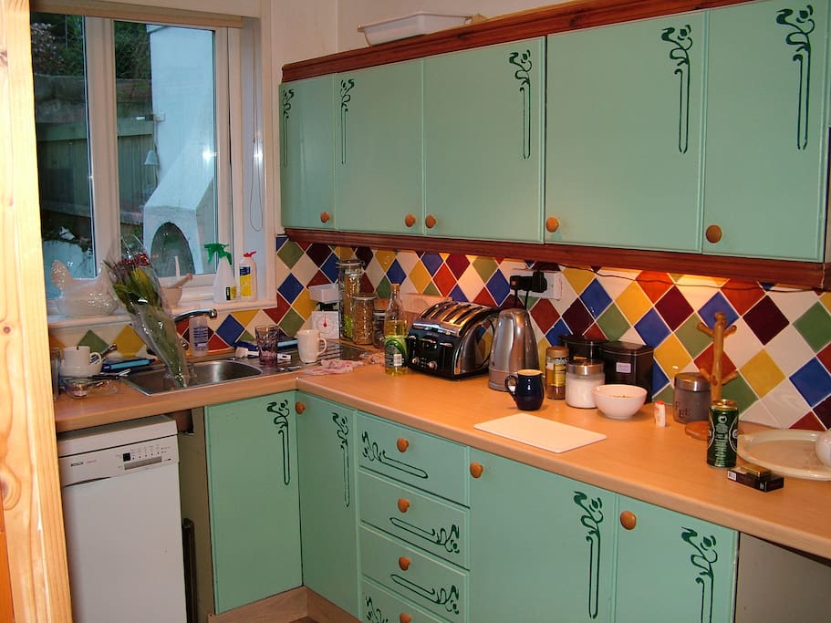kitchen but with cream cupboards now - fully fitted with double range cooker and dishwasher. Not so messy as student house then.
