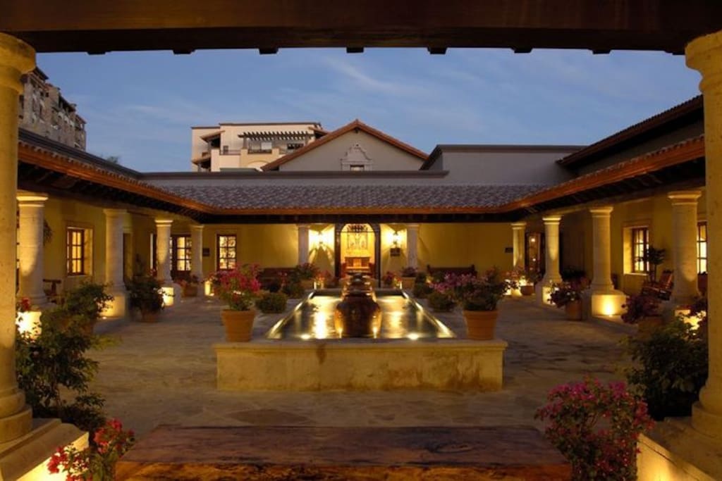 Courtyard facing chapel, with deli, Asian restaurant, gym, stores, and drugstore.