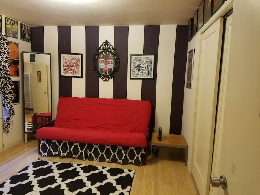 Futon in couch mode, full mirror and closet