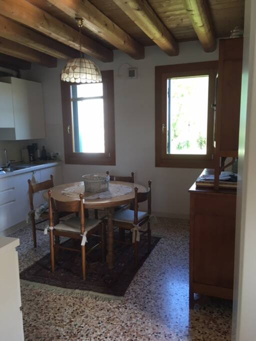 Kitchen with a round table for 6-8 people