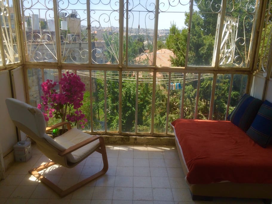 The balcony. Watching the whole neighborhood. Accessible from your room....