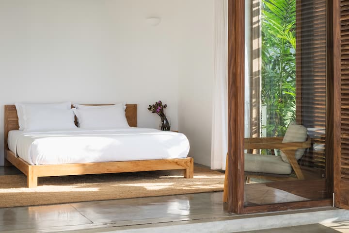 Downstairs king bedroom with private ensuite and courtyard