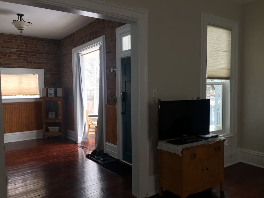 Large living/sitting room with refinished original hardwoods
