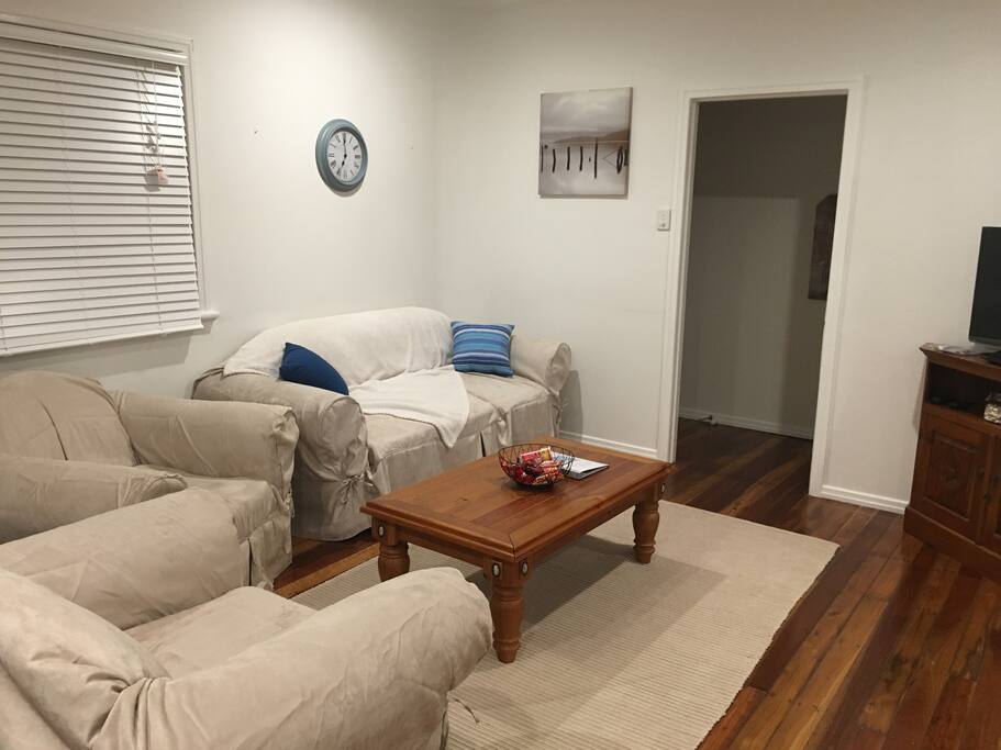 Lounge area with couch and two armchairs. Lounge converts to double sofa bed. An extra double mattress is provided to make this a comfortable sofa bed.