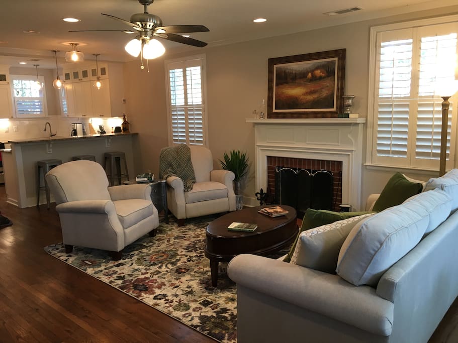 Cozy living room with fireplace and 50" television.