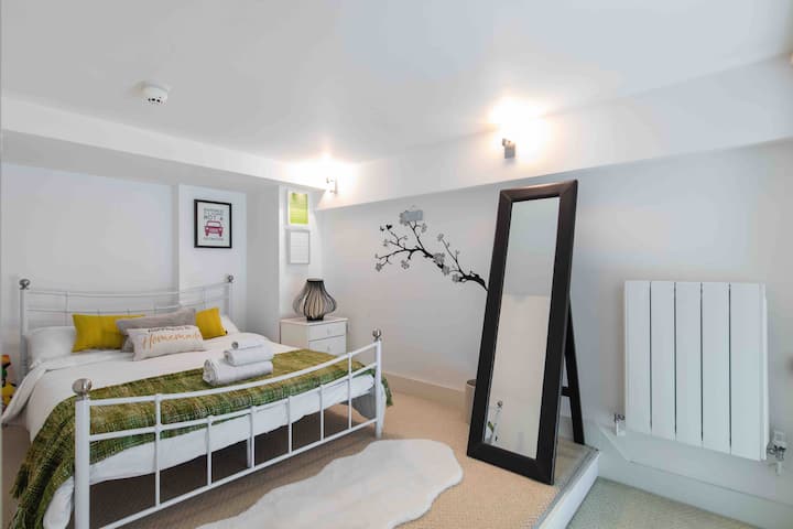 The second guest bedroom has a long mirror and a comfortable bed with brand new mattress provided in January 2023. Spacious, modern, light and airy for ultimate comfort